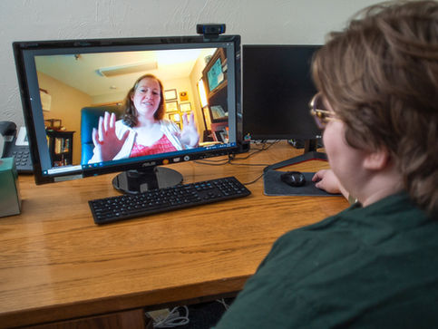 JAMHI clinician interacting warmly with a patient in a comfortable exam room, illustrating compassionate healthcare delivery.
