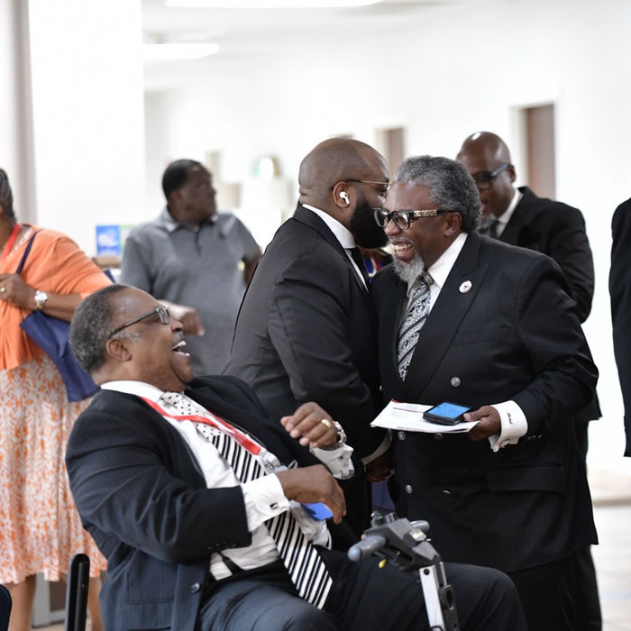 GMBSC leaders and attendees greeting one another inside the church during the Annual Session.