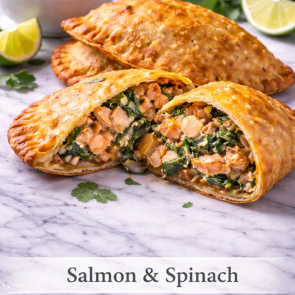 Atlantic salmon and spinach empanada cut open to show salmon, spinach and creamy filling