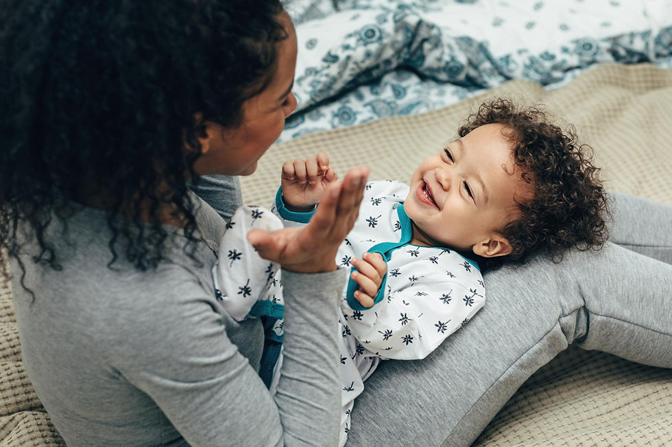 High angle view of mother playing with son at home