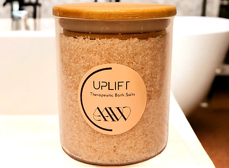 Uplift Bath Salts displayed on bathroom counter.
