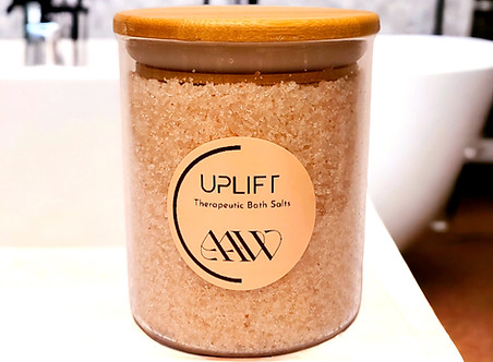 Uplift Bath Salts displayed on bathroom counter.
