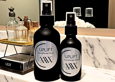 Revive Aromatherapy Spray image of both the 4oz and 2oz next to each other on bathroom countertop.