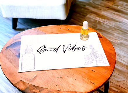 Good Vibes Essential Oil Blend Sample 2ml on wood table.