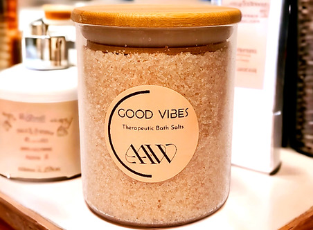 Good Vibes Bath Salts displayed on bathroom counter.