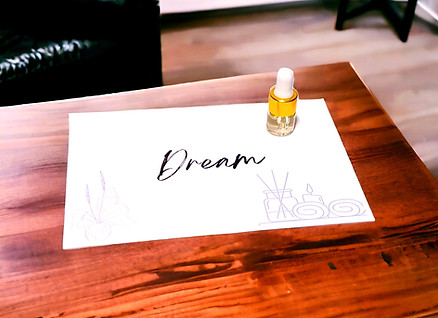Dream Essential Oil Blend Sample 2ml on wood table.