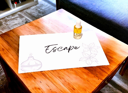 Escape Essential Oil Blend Sample 2ml on wood table.