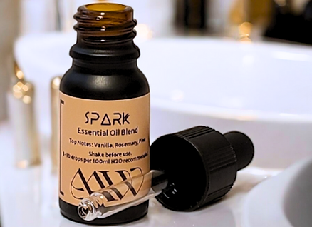 Spark Essential Oil Blend 10ml on bathroom countertop.