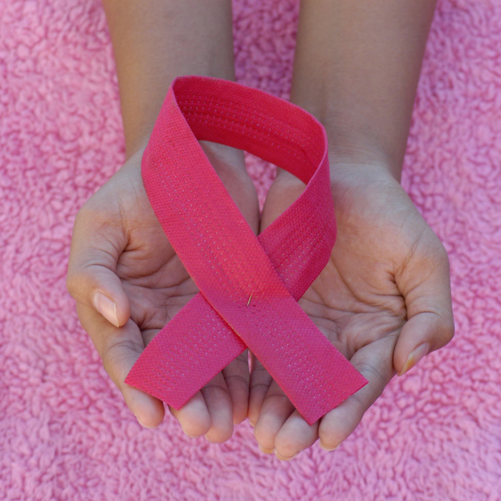 Pink Breast Cancer Awareness Ribbon Held in Hands-Oncology Massage