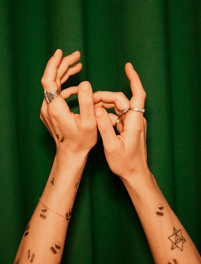 Hands gently intertwined, symbolizing connection and self-healing.