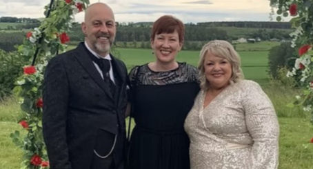 Debbie with bride and groom