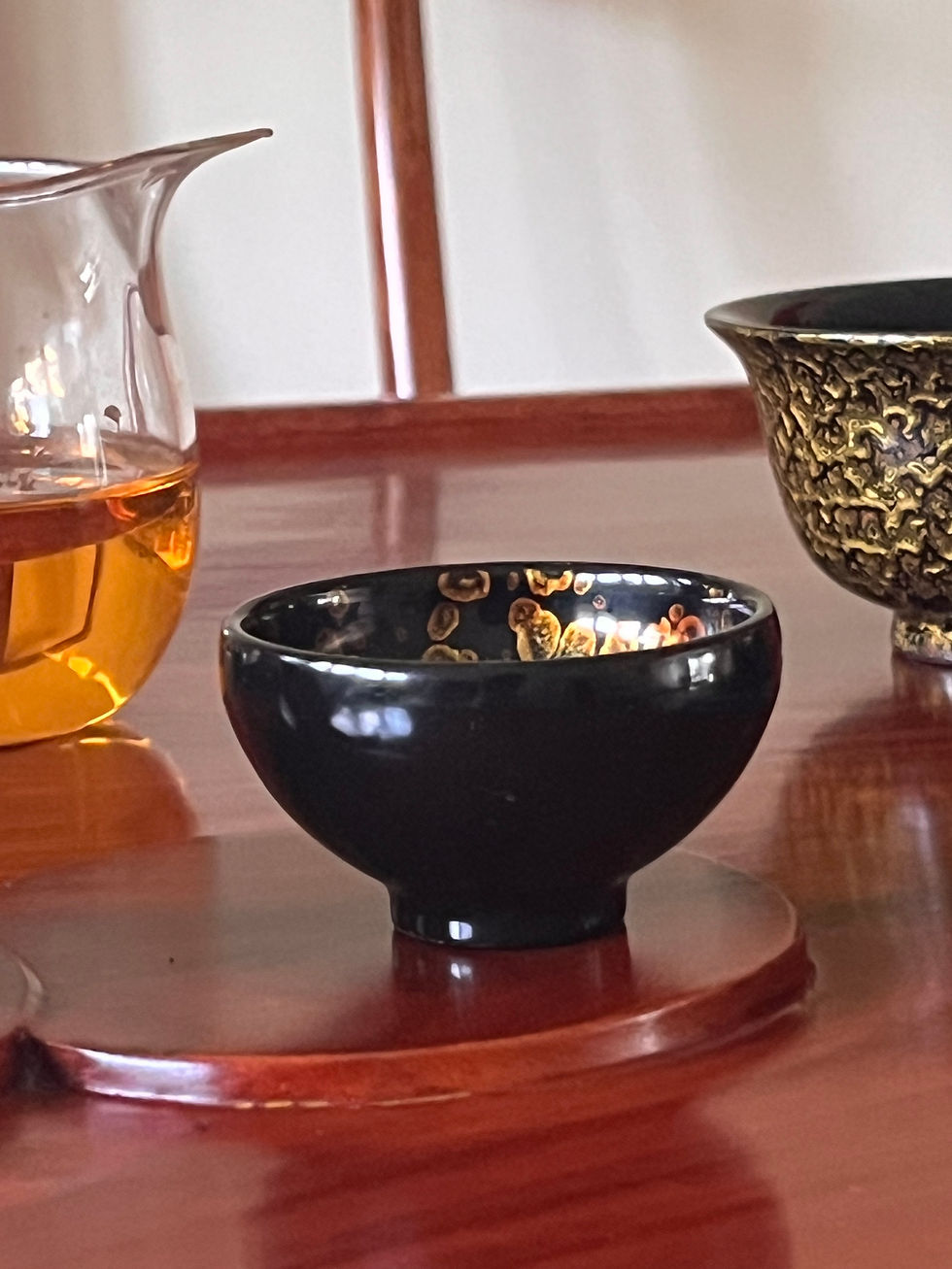 Handcrafted Chinese lacquer tea cup on traditional tea table by HFD LACQUERWARE