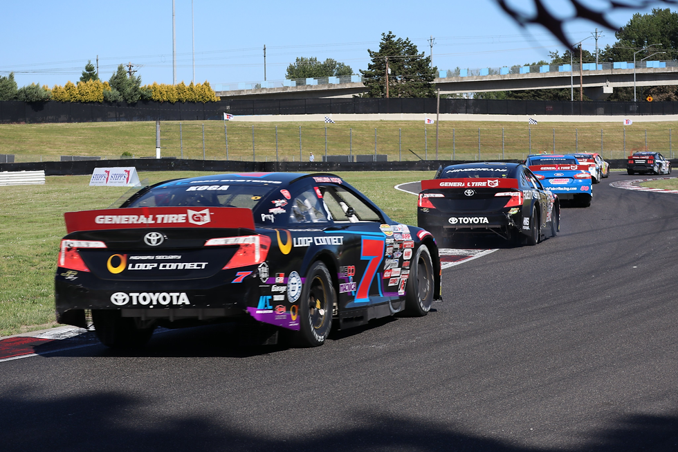 Takuma Koga drives at Portland.