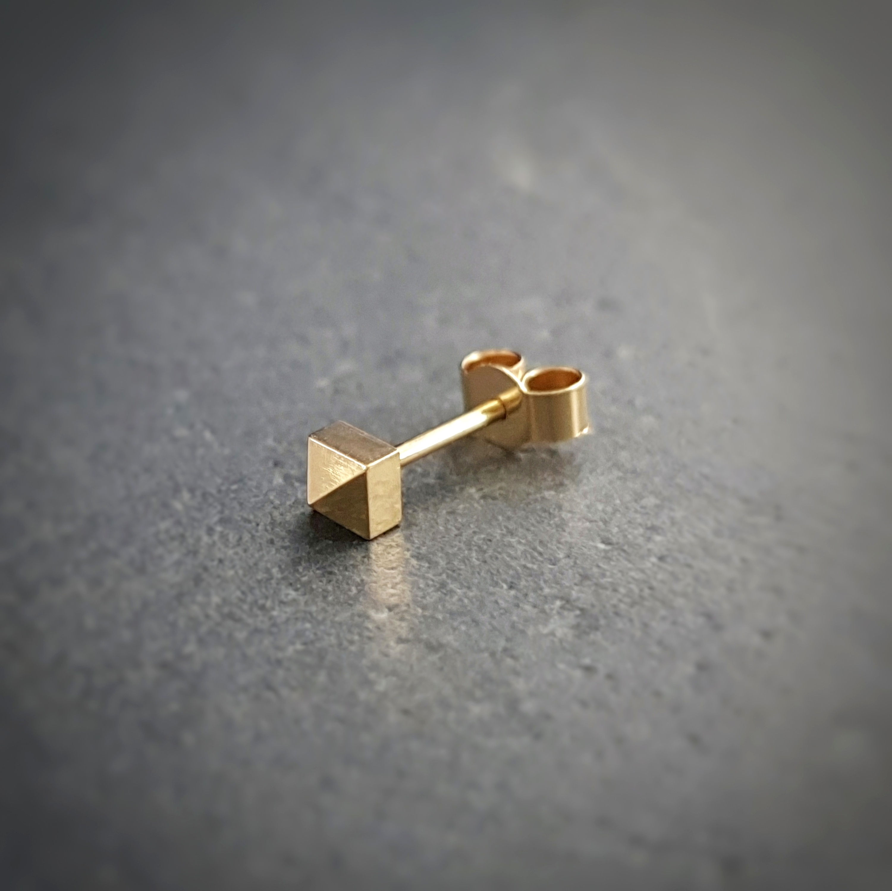 18ct gold pyramid spike stud earring from jeweller Natalia McIntosh