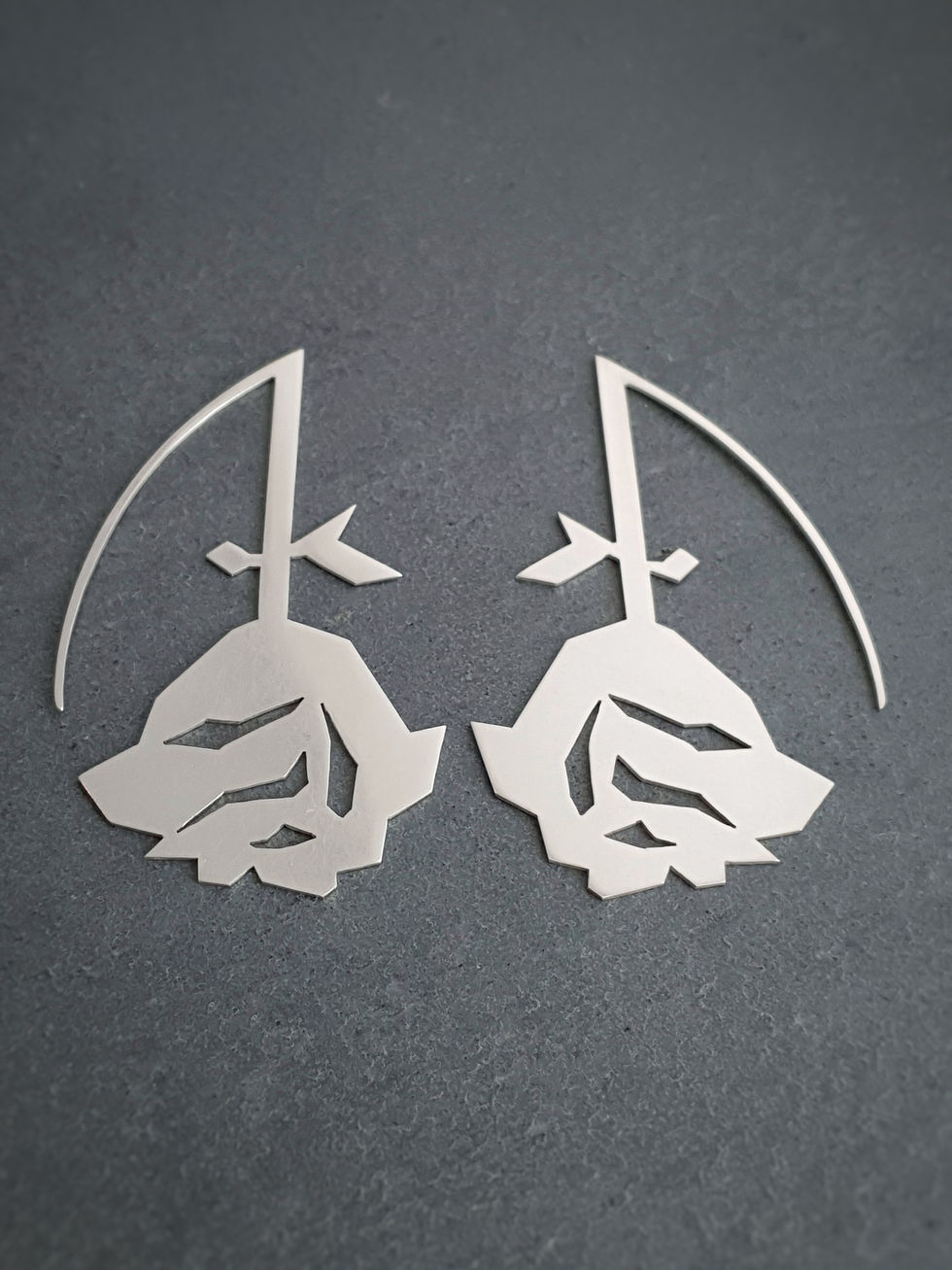 Thumbnail: geometric rose statement earrings from designer Natalia McIntosh
