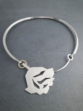 Bold choker collar with geometric rose design at its centre in recycled sterling silver and 18 carat gold. From jewellery designer Natalia McIntosh.