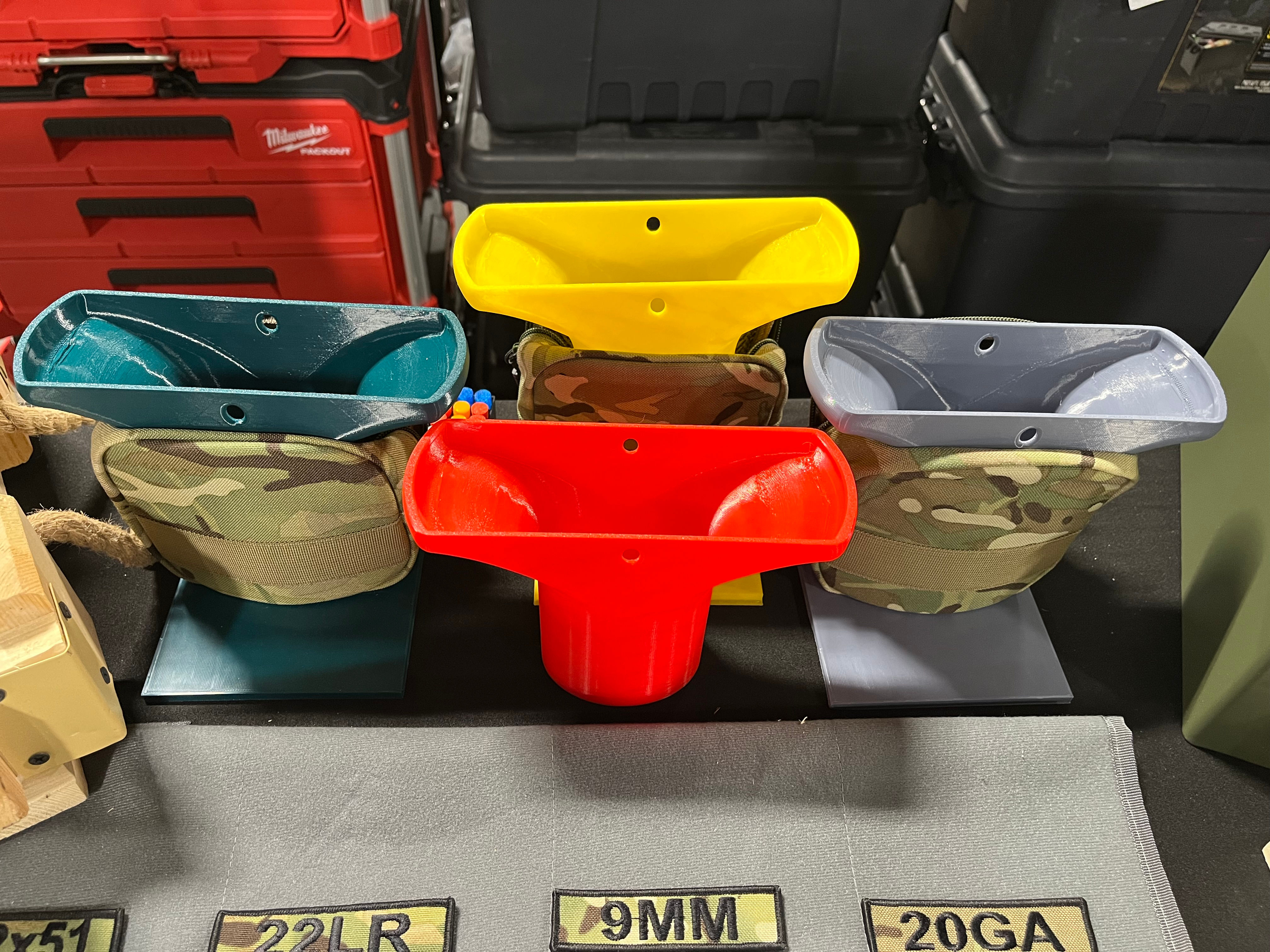 3D printed funnels that are meant to help load ammunition into the ammo pouch