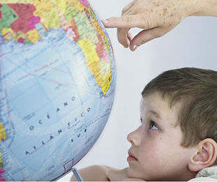 Child Observing Globe