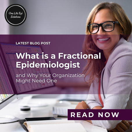 A woman smiling while sitting in front of a screen with a spreadsheet