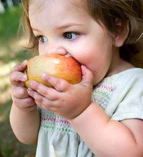 Child Eating Apple