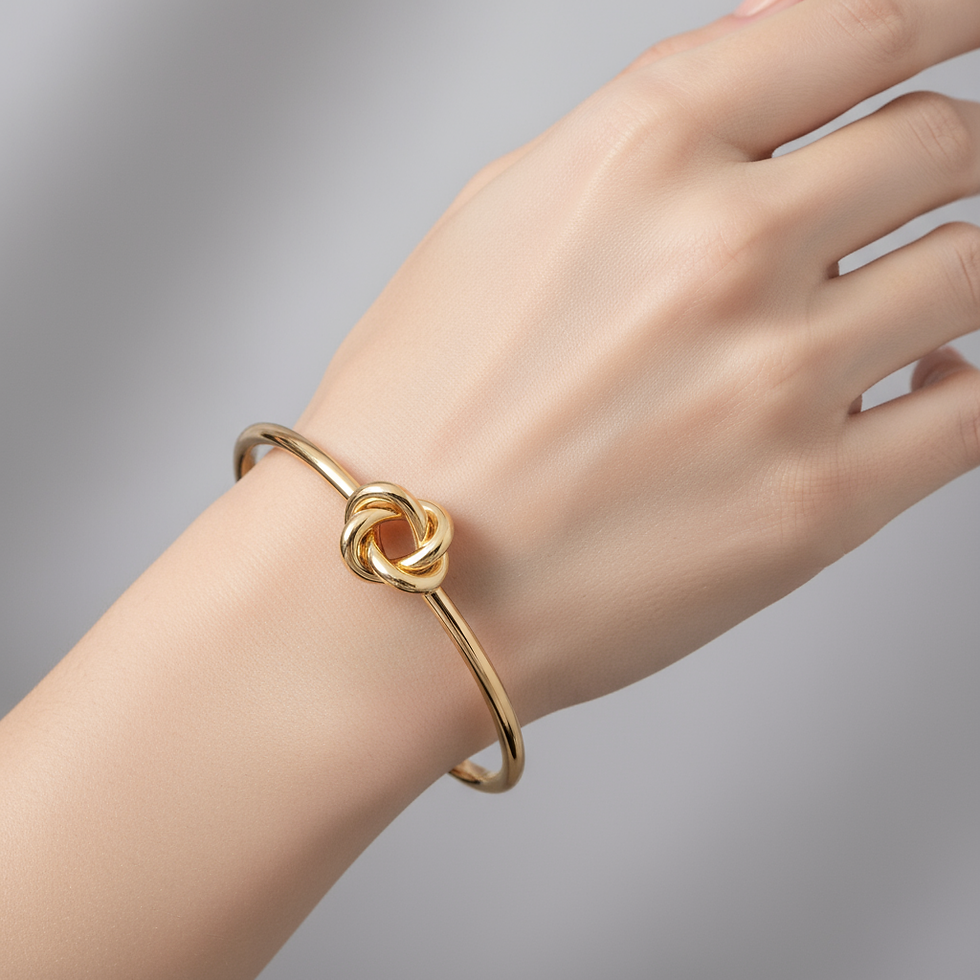 Gold bracelet featuring elegant knot design