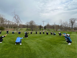 Warming up before swinging their clubs.