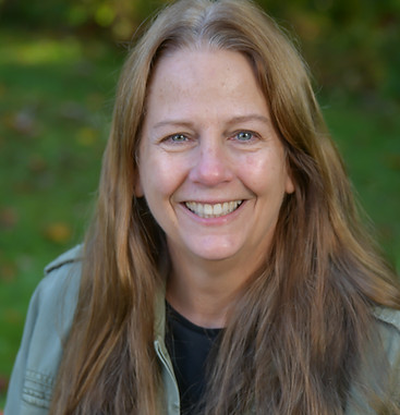 A smiling photo of WLC Co-director, Deb Daniels