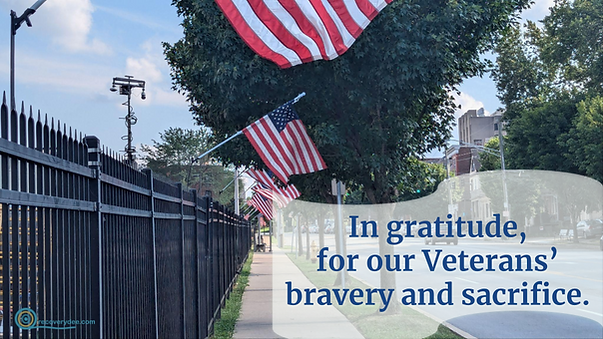 Quotepic expression of gratitude to veterans set against a line of American flags in front of the VA in Cincinnati