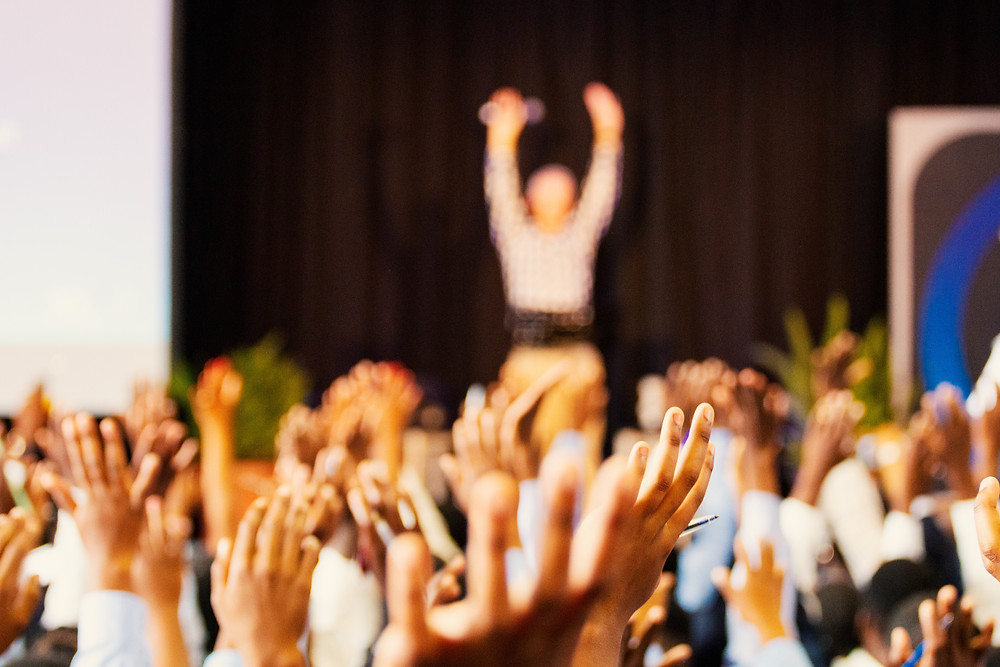 Hands raised at forum