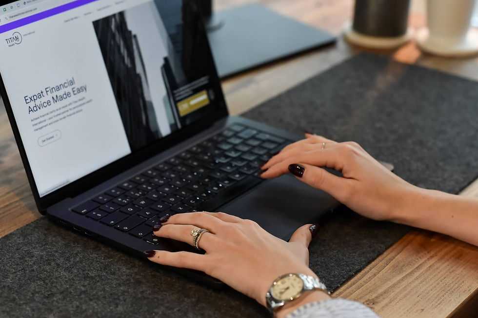 Woman's hands with gel nails working on laptop