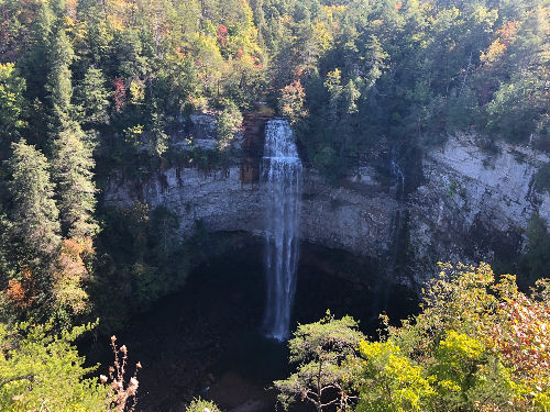 Waterfall in a wooded Tennessee gorge, the kind of terrain on the Cummins Falls gorge route from Nashville