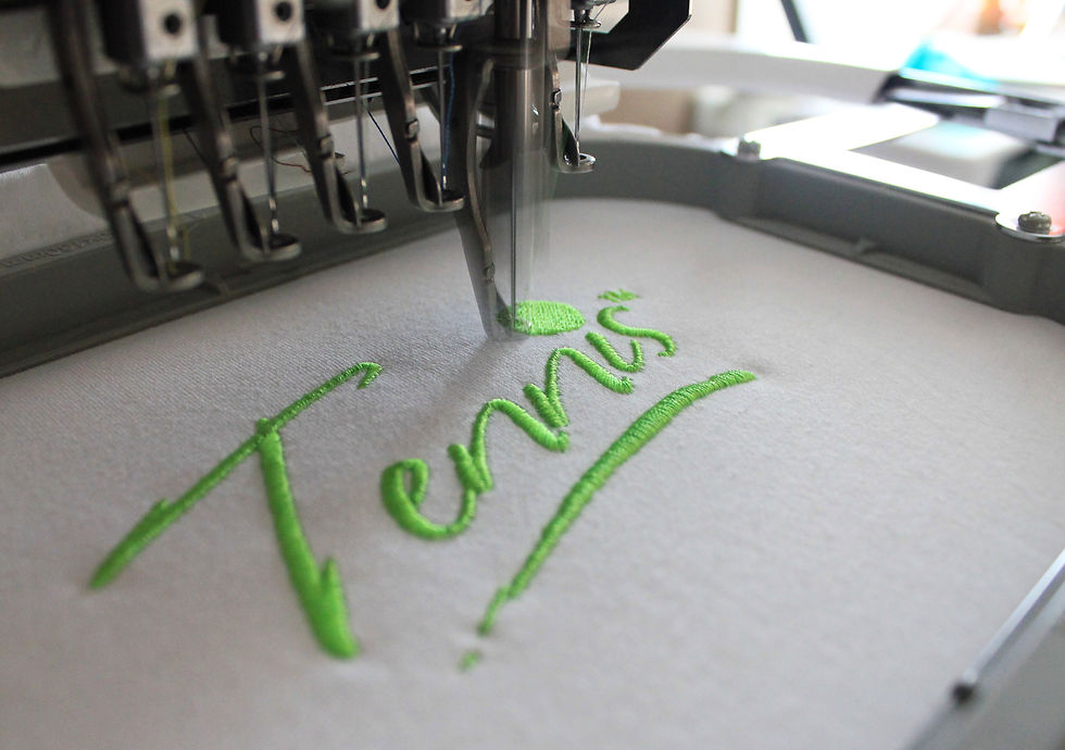 embroidered logo being stitched onto a garment