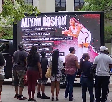 This is a photo of the Lady Gamecock parade featuring Aliyah Boston.