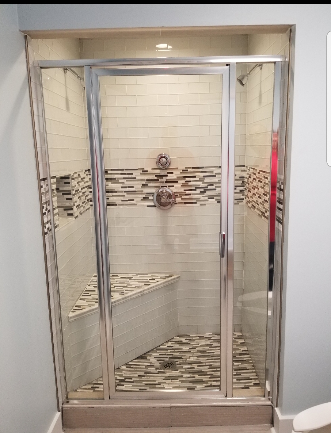 Framed shower enclosure