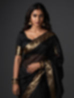 South Indian woman in black saree representing Gurugram escorts