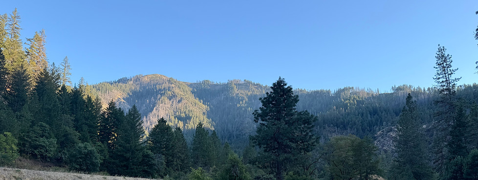 scenic view of mountains and field at Del Loma Campground