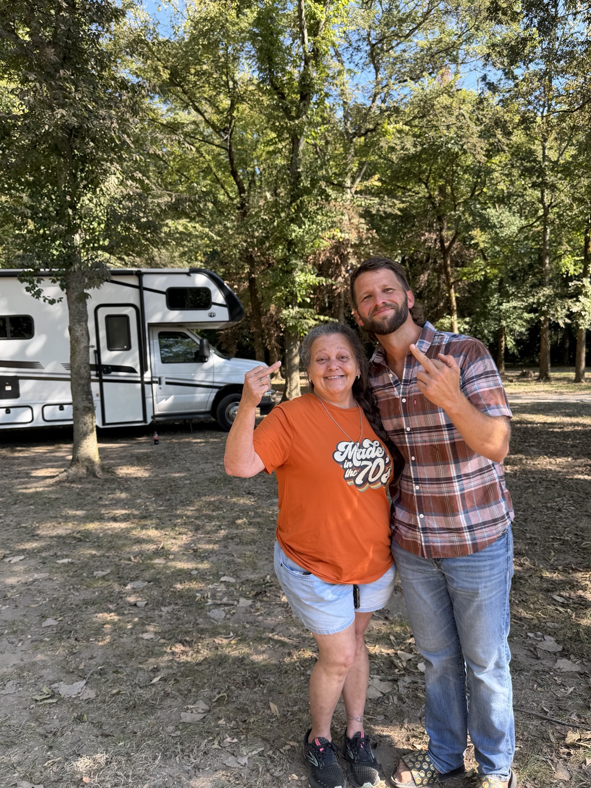 Dustin and Beth together beside the RV at Rocky River Resort.