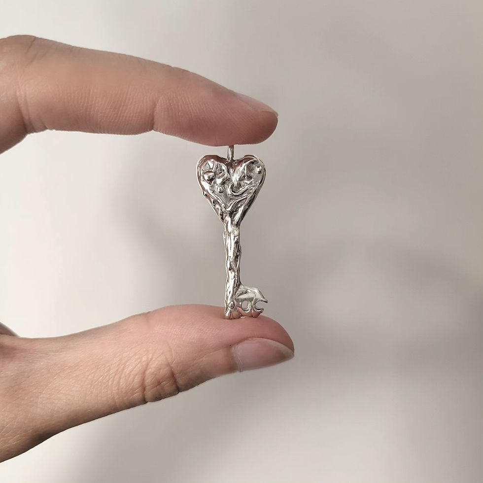 Miniature : Sterling silver heart-shaped organic key pendant on a chain