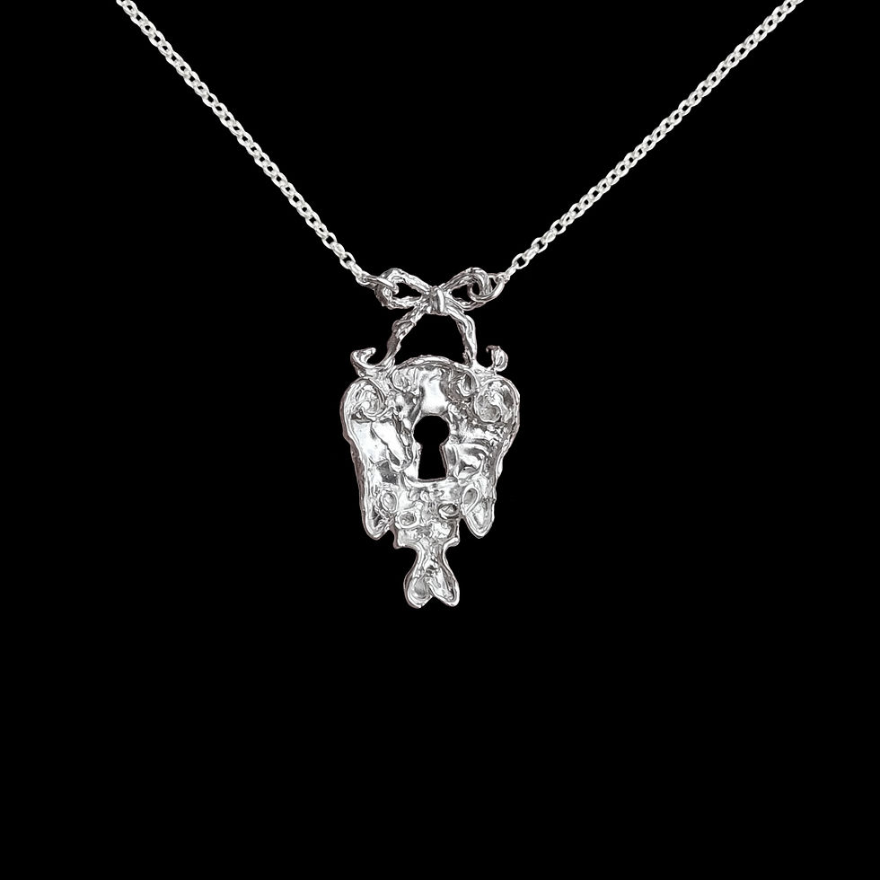 Organic keyhole pendant topped with a bow