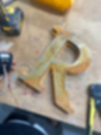 built up rusted lettering