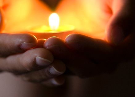 Hands holding candles (2).jpg