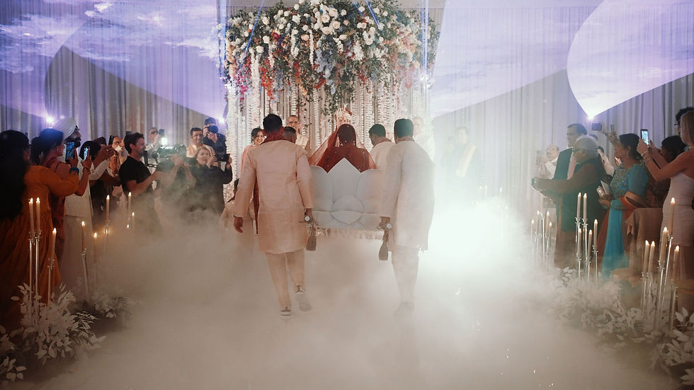 Anjali walks down the aisle as lasers and production lighting fill the Western ceremony at Omni PGA Frisco