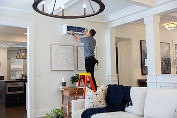 HVAC technician installing a heat pump system