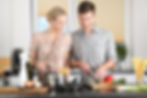Woman and man making dinner together