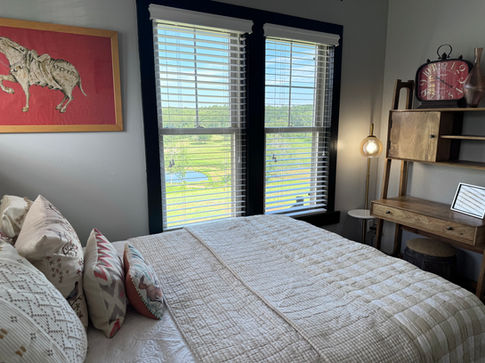 Poppy's Corner Bedroom with two queen beds and cozy decor at Rock Creek Venue.