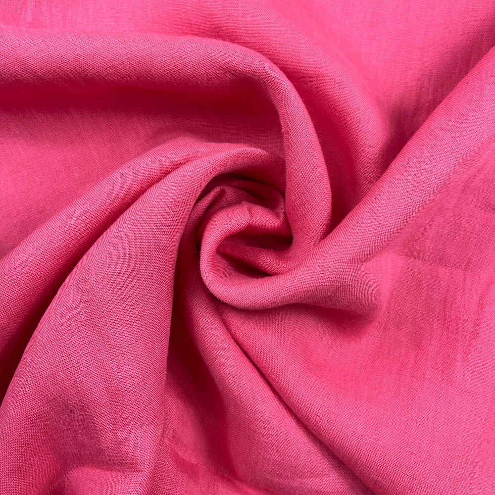Einfarbiger Leinenstoff in kräftigem Pink mit natürlicher, leicht strukturierter Oberfläche