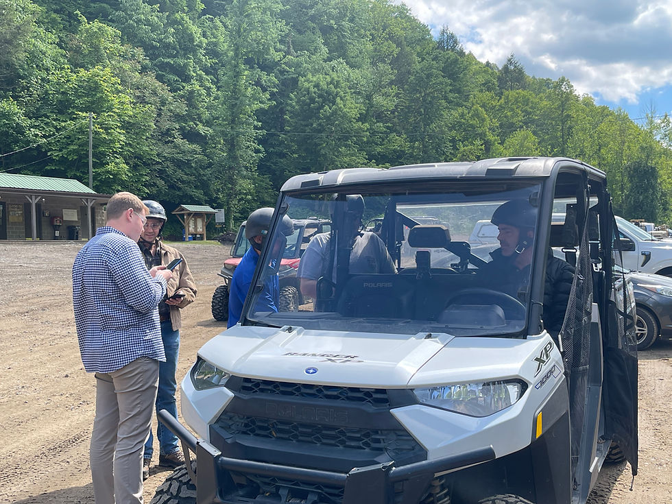 Justice Titus and his campaign manager, Carter Davidson (left), preparing for their ride up the mountain with Man Mayor and Hatfield-McCoy Trails Executive Director John Fekete (right).