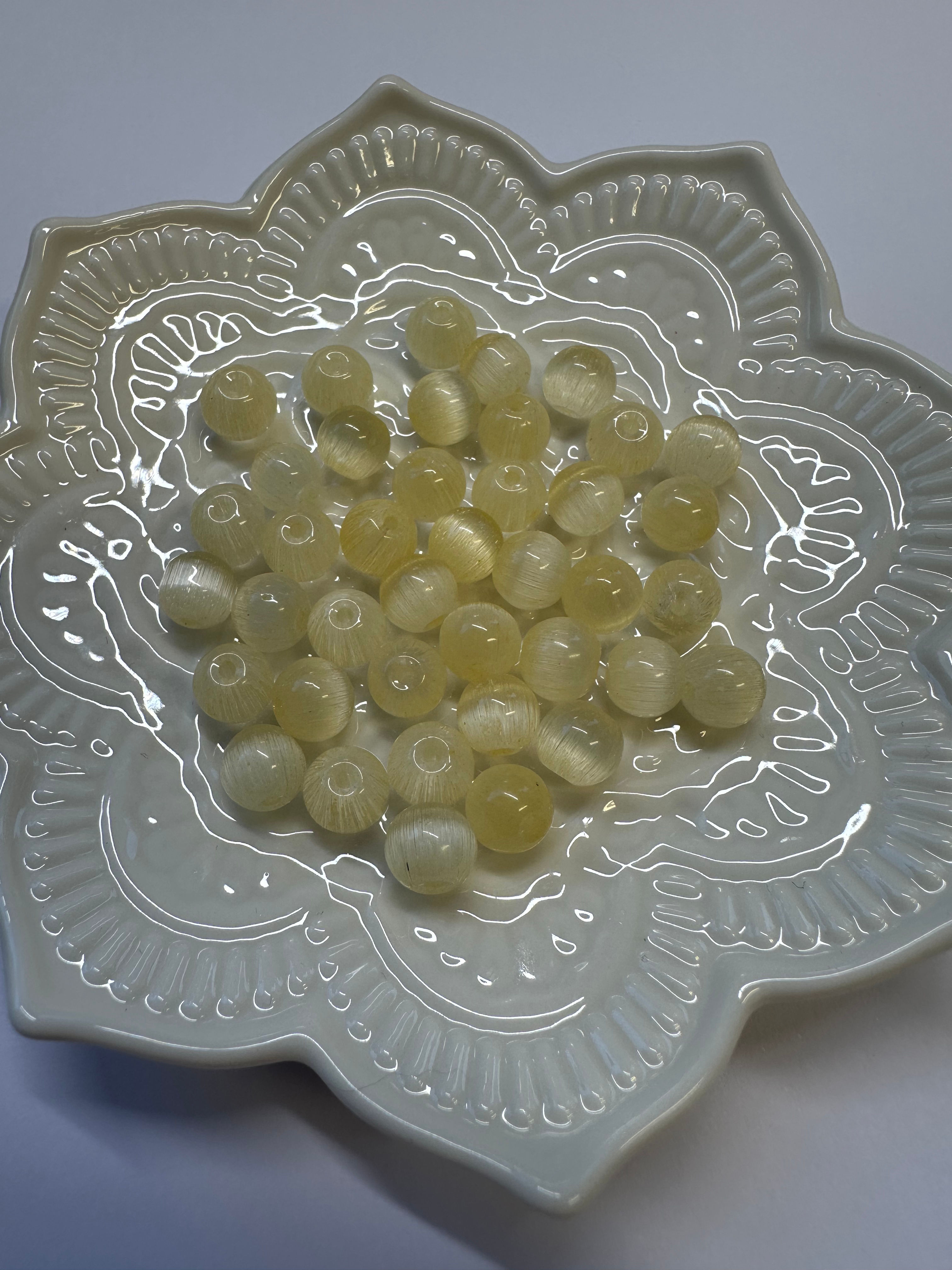 Gula cat eye pärlor i glas 8mm