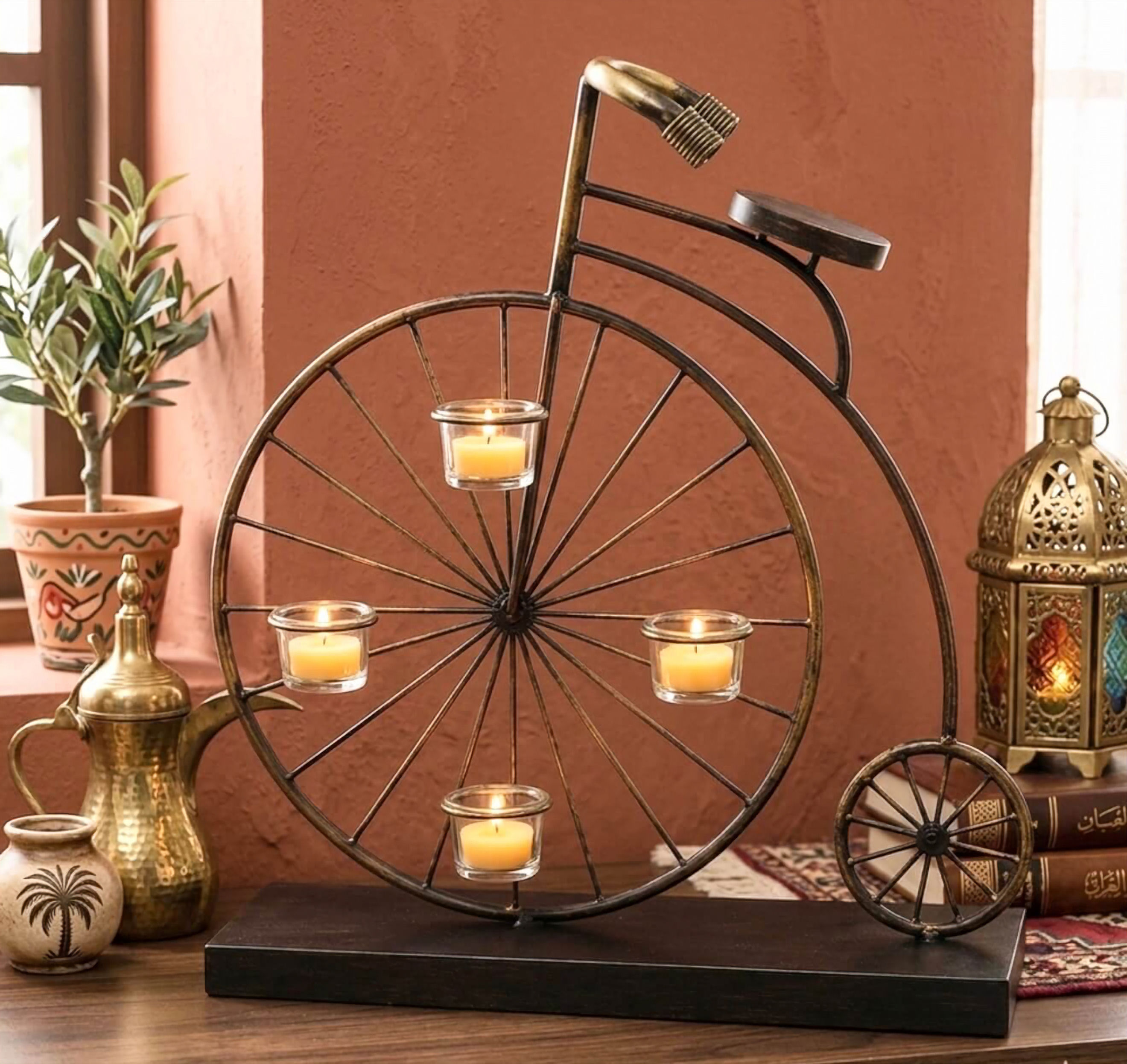Vintage metal bicycle tealight holder with 4 lit candles