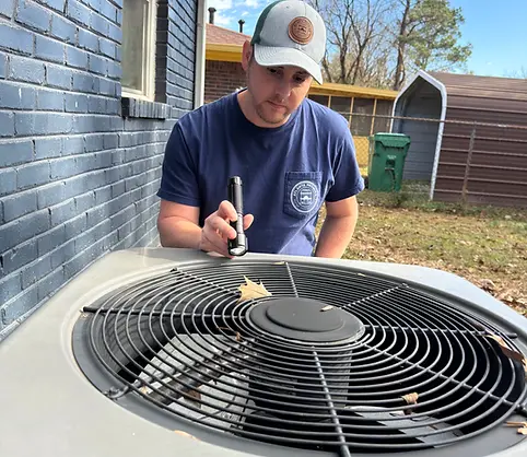 Licensed home inspector in Atlanta inspecting HVAC unit